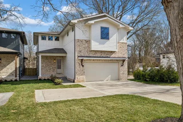 Two-story modern build with brick base